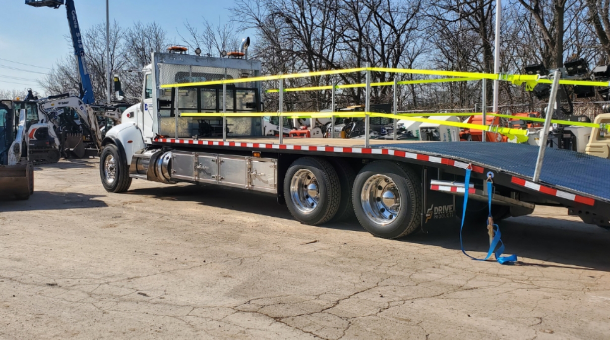 Drive Products truck unloading Sterling GP plant body.